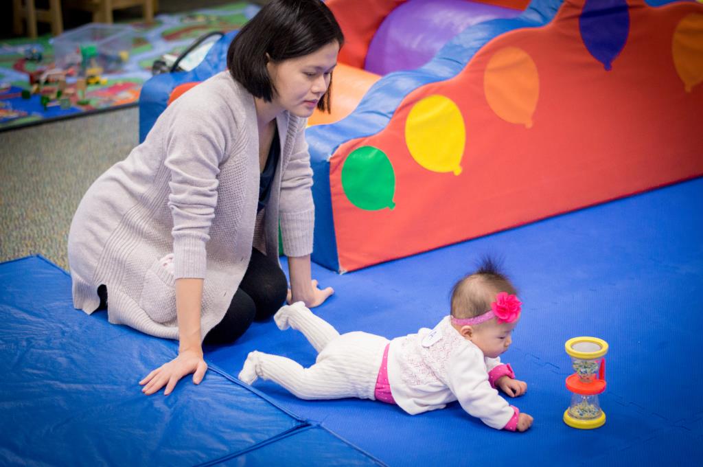 Mom & daughter on mat at playgroup