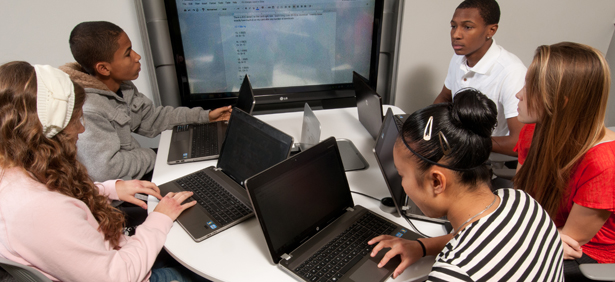 Group of 5 Innovation High students working together