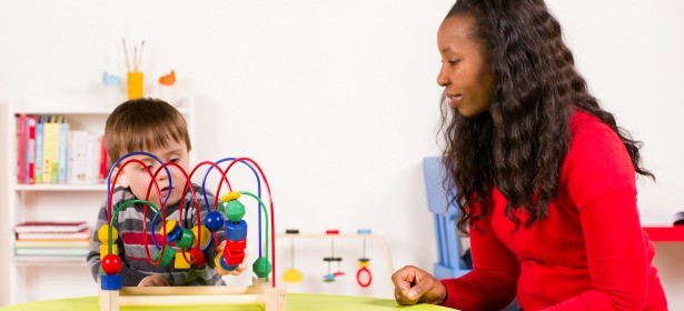 Teacher and child playing