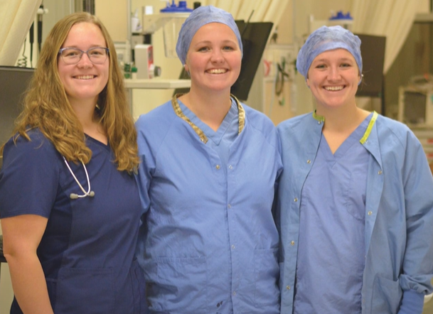 3 female students in medical scrubs clothing